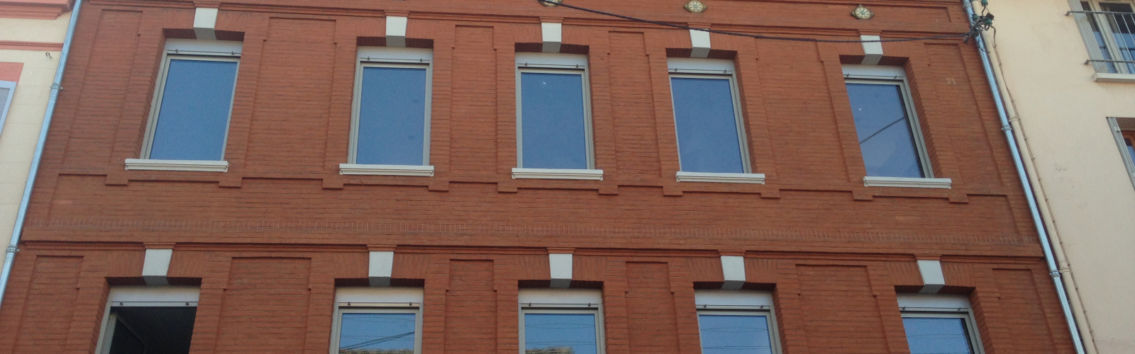 Menuiseries fenêtres en bois bâtiment ancien à Toulouse - Réalisation Chomette